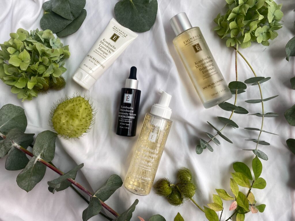 High-End Skincare Products From Eminence Surrounded By Eucalyptus Stems