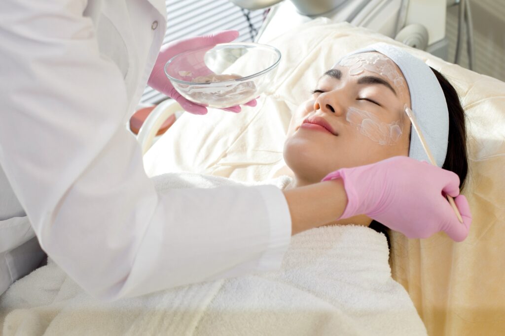 Image Of Woman Getting A Facial Treatment.