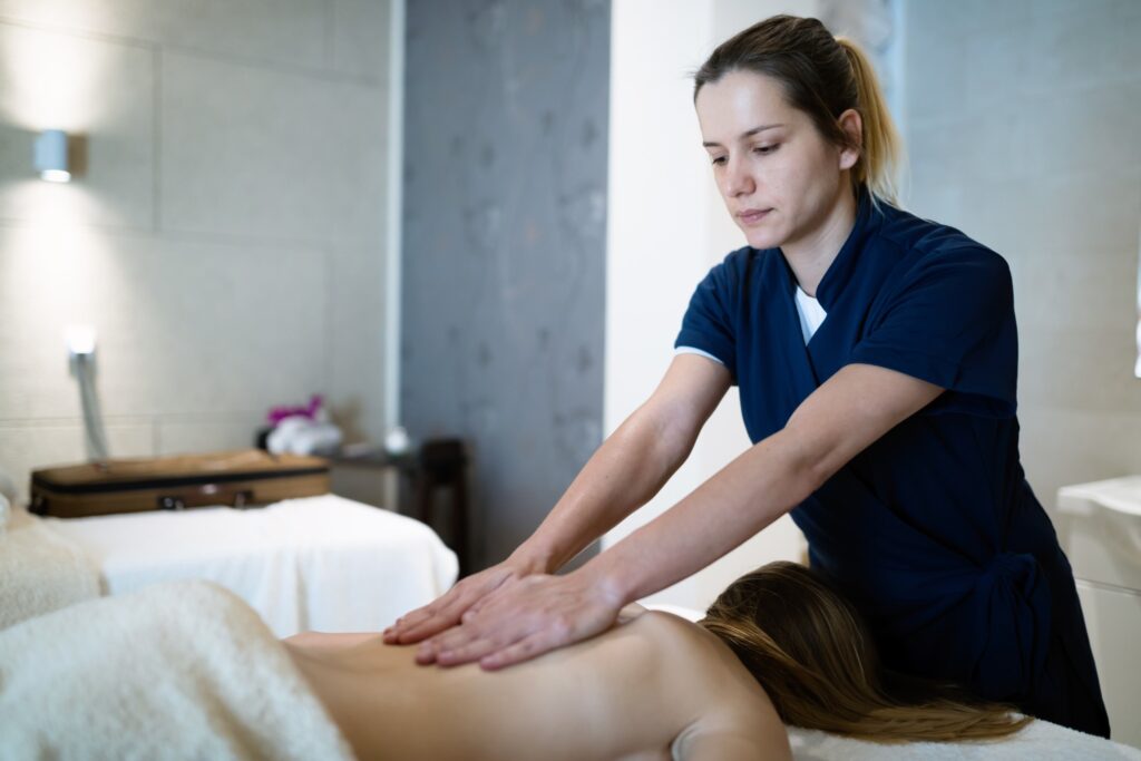 Image Of Woman Providing Professional Massage.