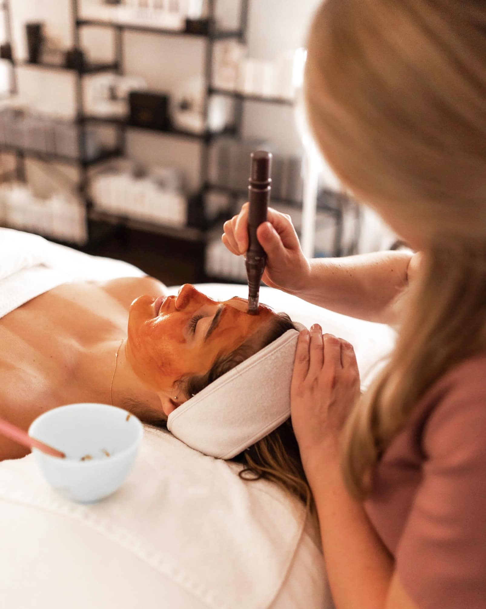 infusion facial treatment with microchanneling Image of a woman in a spa receiving an infusion facial with microchanneling